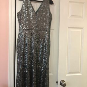 Silver sequin dress with a pale green hue.